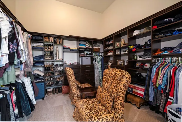 a dining room with furniture a chandelier and wooden floor