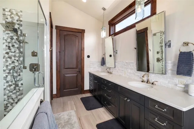 a bathroom with a shower and a mirror