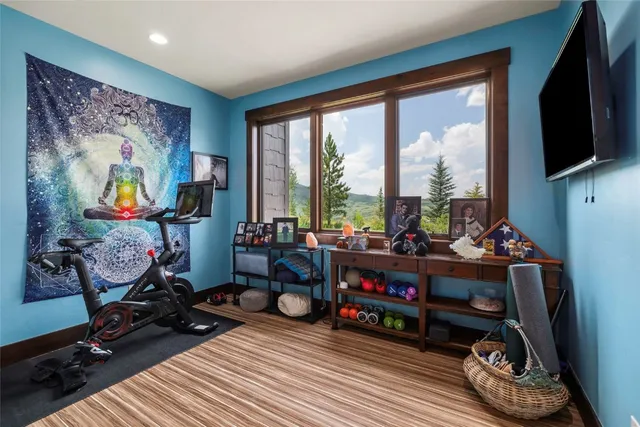 a living room with furniture a table and chairs