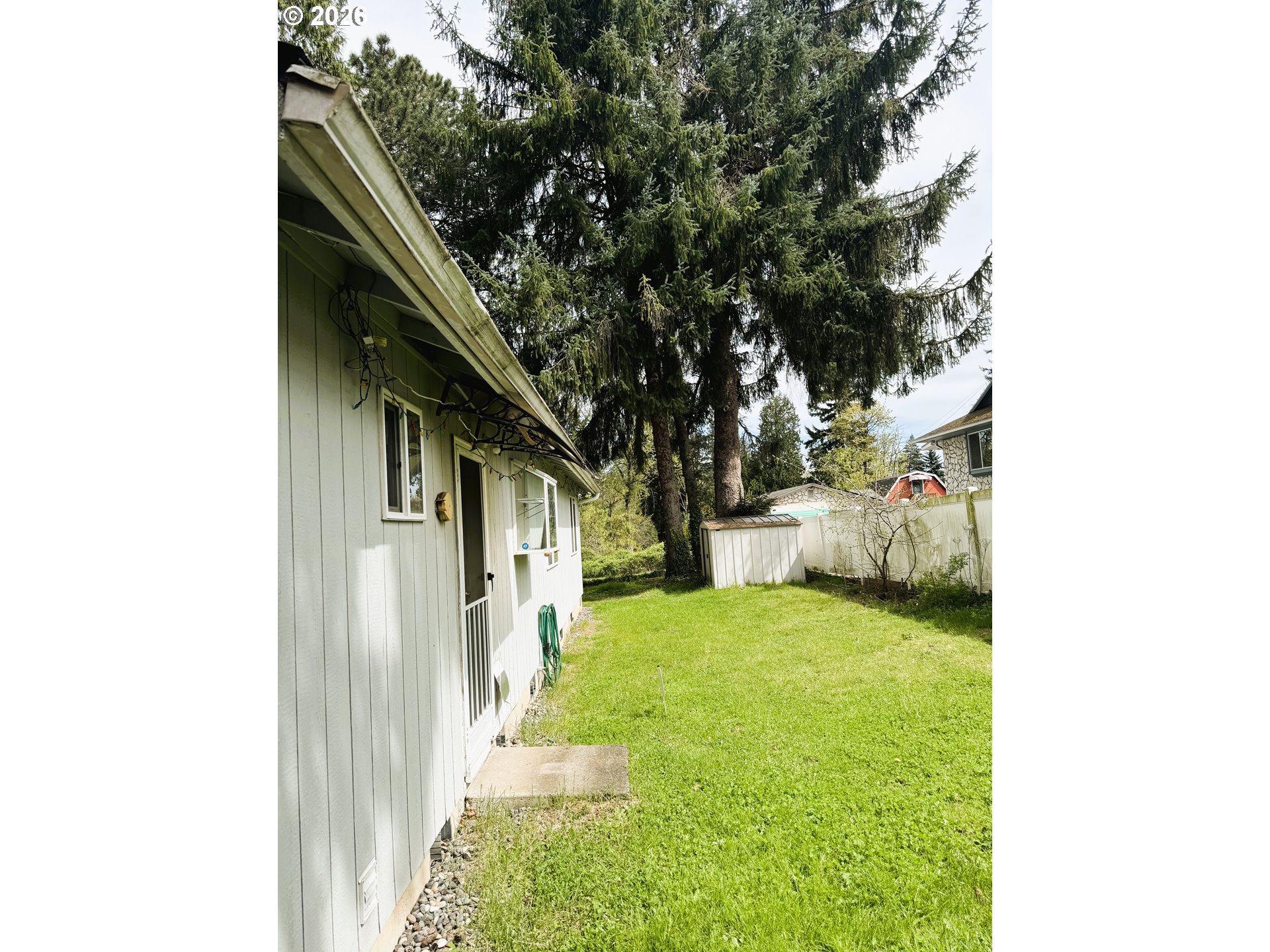 1918 Southeast Regner Road Gresham, OR 97080 - Photo 44 of 48 a yellow house with outdoor space