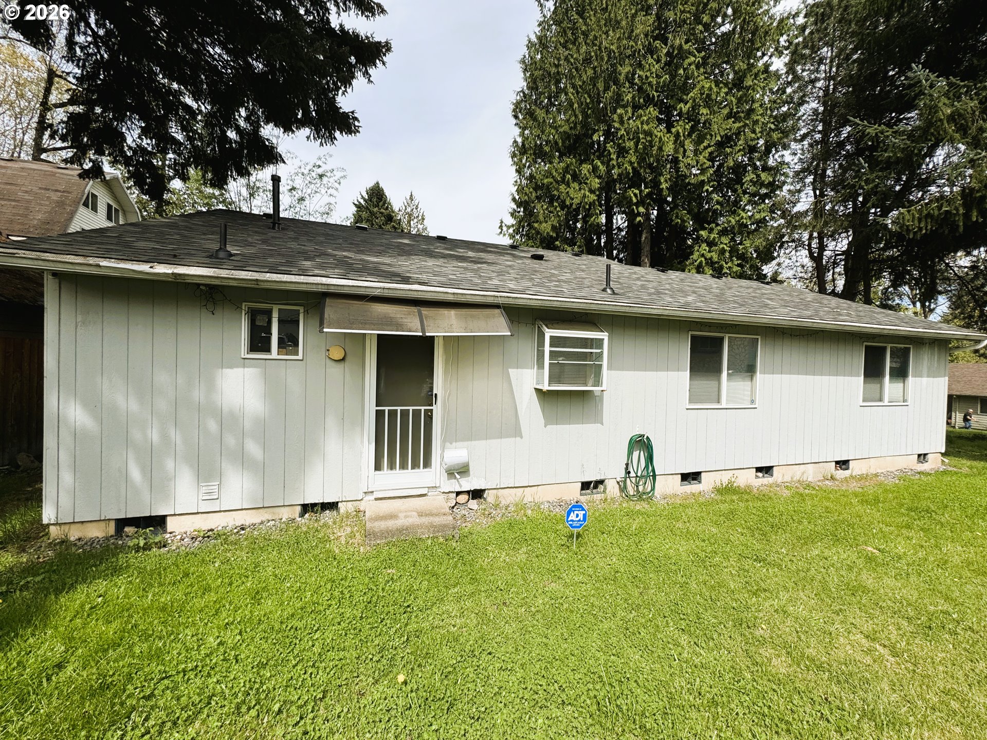 1918 Southeast Regner Road Gresham, OR 97080 - Photo 46 of 48 a backyard of a house with yard and outdoor seating