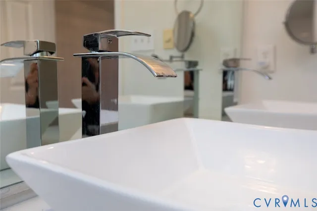 a large white bed in a small kitchen