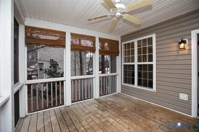 a view of a balcony with a ceiling fan