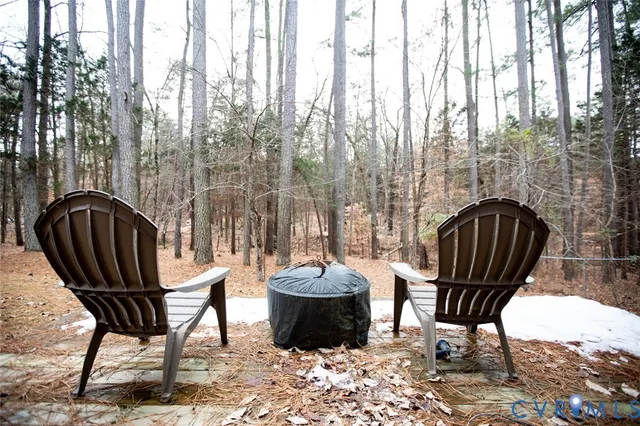 a view of a balcony with chair and a potted plant