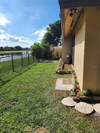 a view of a backyard with sitting area