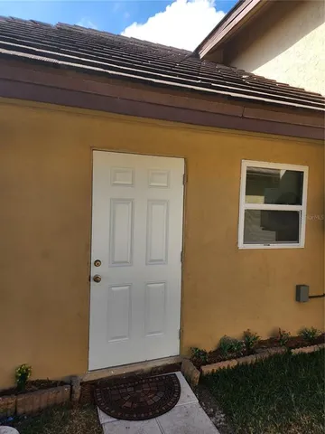 a room with a stove and a microwave