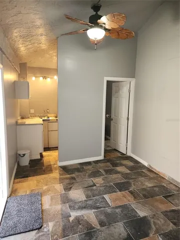 a view of a livingroom with the kitchen