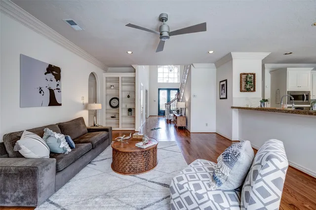 a living room with furniture or couch and a wooden floor