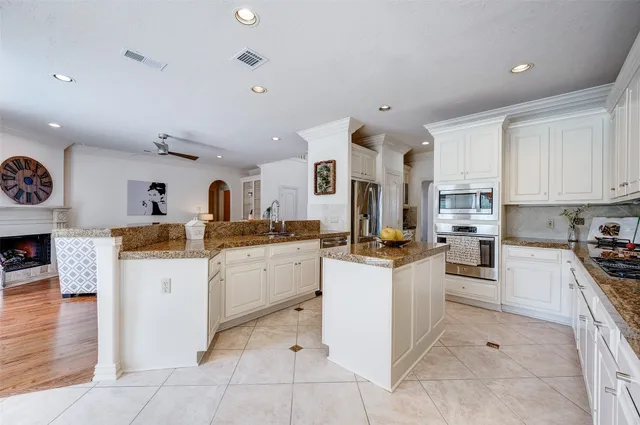 a kitchen with sink and cabinets