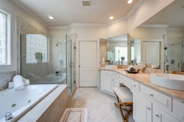 a spacious bathroom with a granite countertop sink mirror and shower