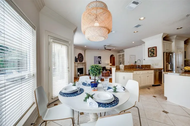 a dining room with furniture and wooden floor