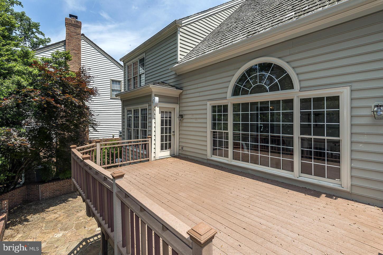 9730 Hidden Valley Road Vienna, VA 22181 - Photo 13 of 30 a view of house with deck and outdoor space