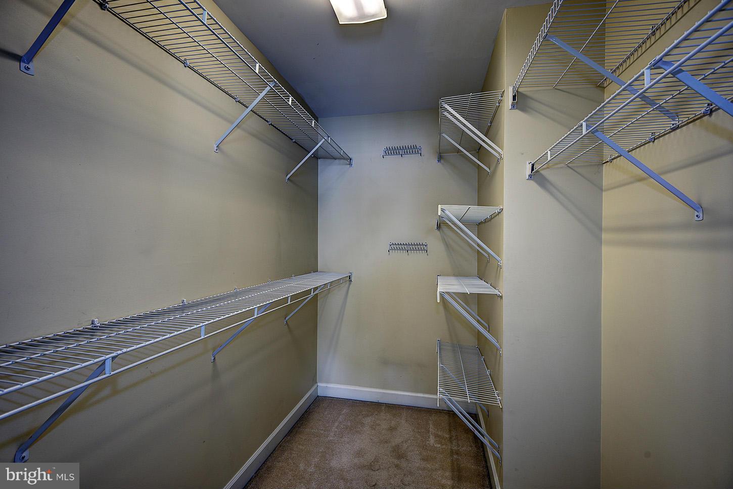 9730 Hidden Valley Road Vienna, VA 22181 - Photo 17 of 30 a view of storage and utility room with racks on the wall