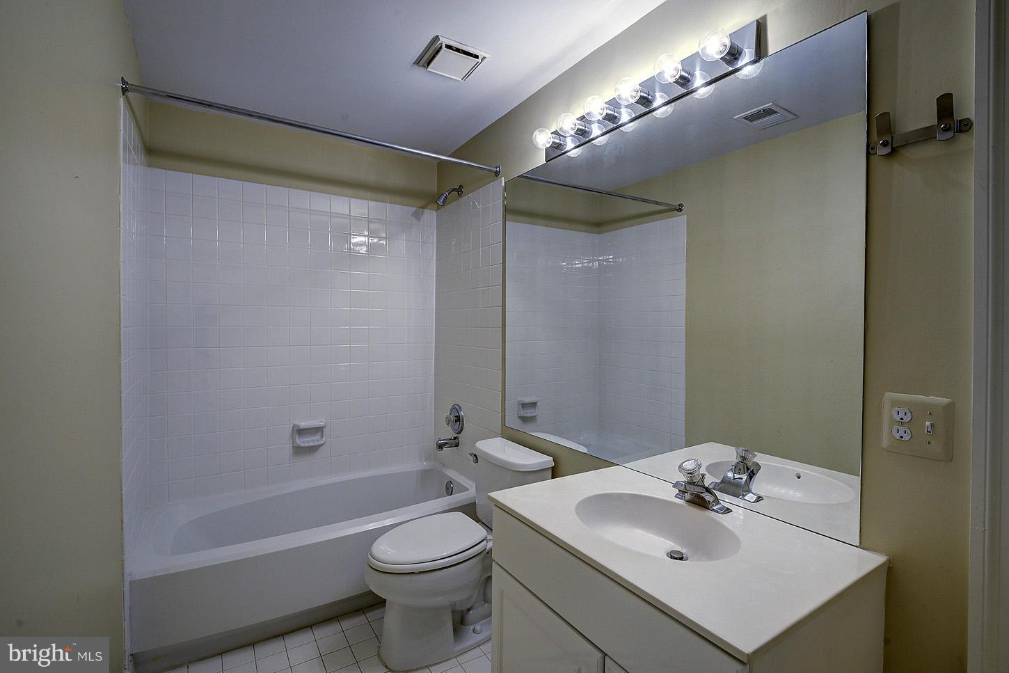 9730 Hidden Valley Road Vienna, VA 22181 - Photo 23 of 30 a bathroom with a sink toilet and shower