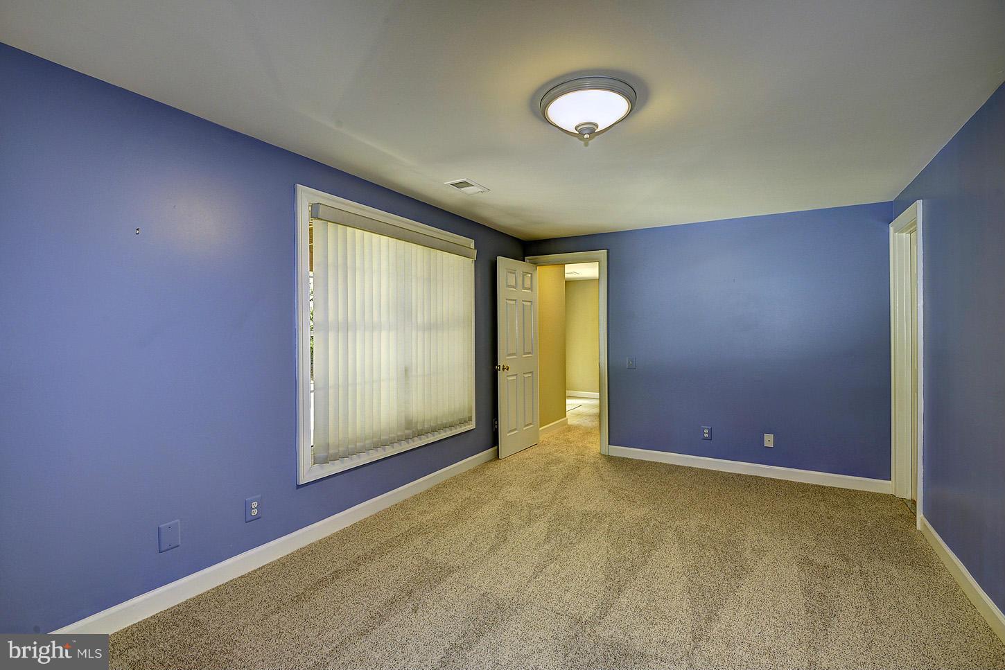 9730 Hidden Valley Road Vienna, VA 22181 - Photo 24 of 30 an empty room with windows