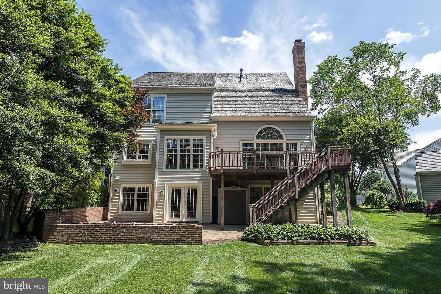 9730 Hidden Valley Road Vienna, VA 22181 - Photo 28 of 30 a front view of a house with a yard