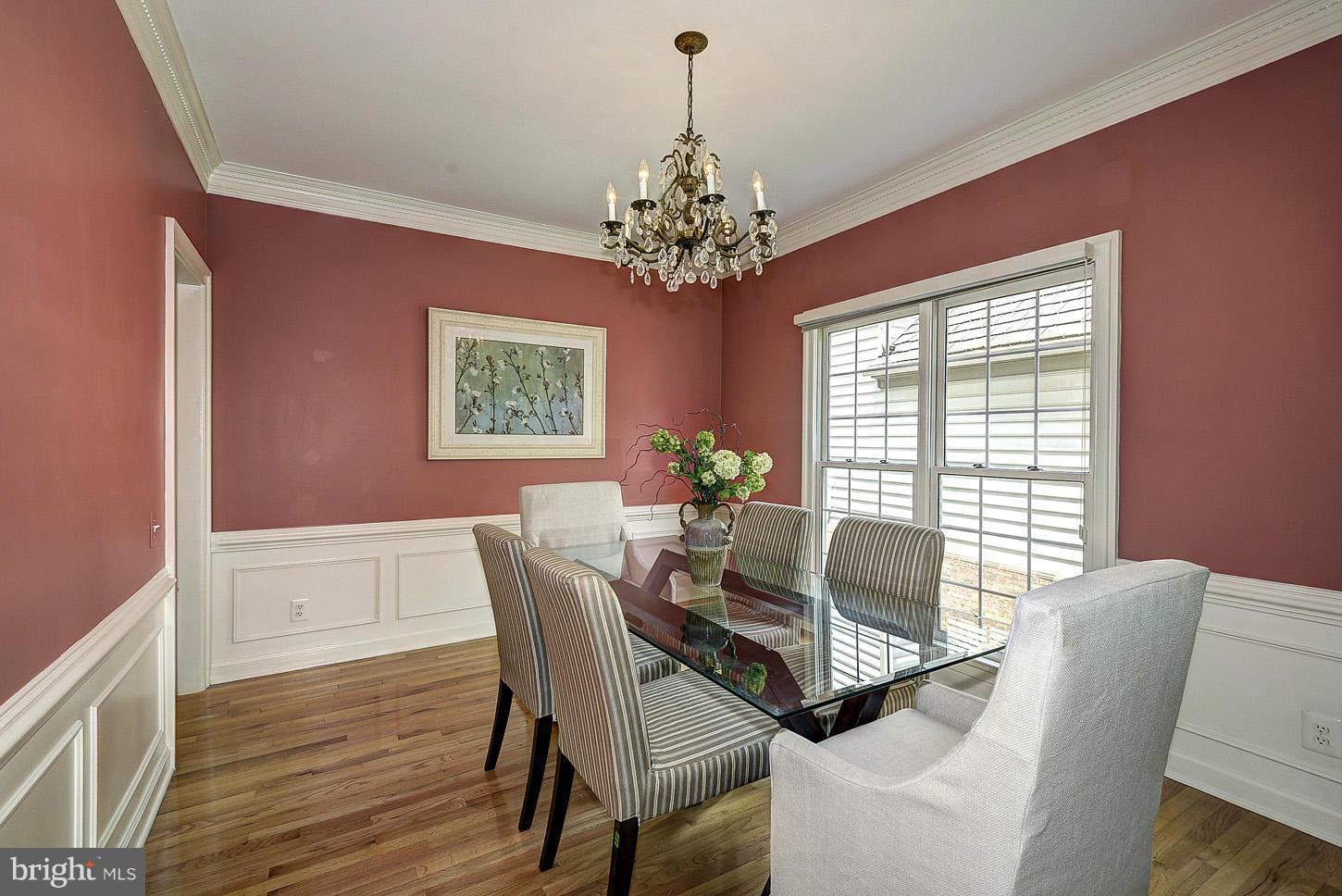 9730 Hidden Valley Road Vienna, VA 22181 - Photo 4 of 30 a dining room with furniture a chandelier and wooden floor