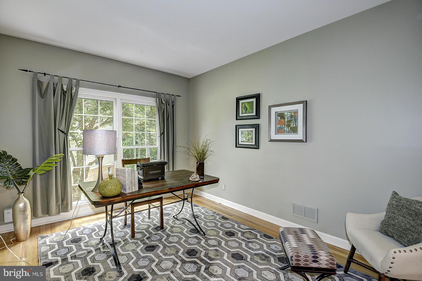 9730 Hidden Valley Road Vienna, VA 22181 - Photo 7 of 30 a living room with furniture and a window