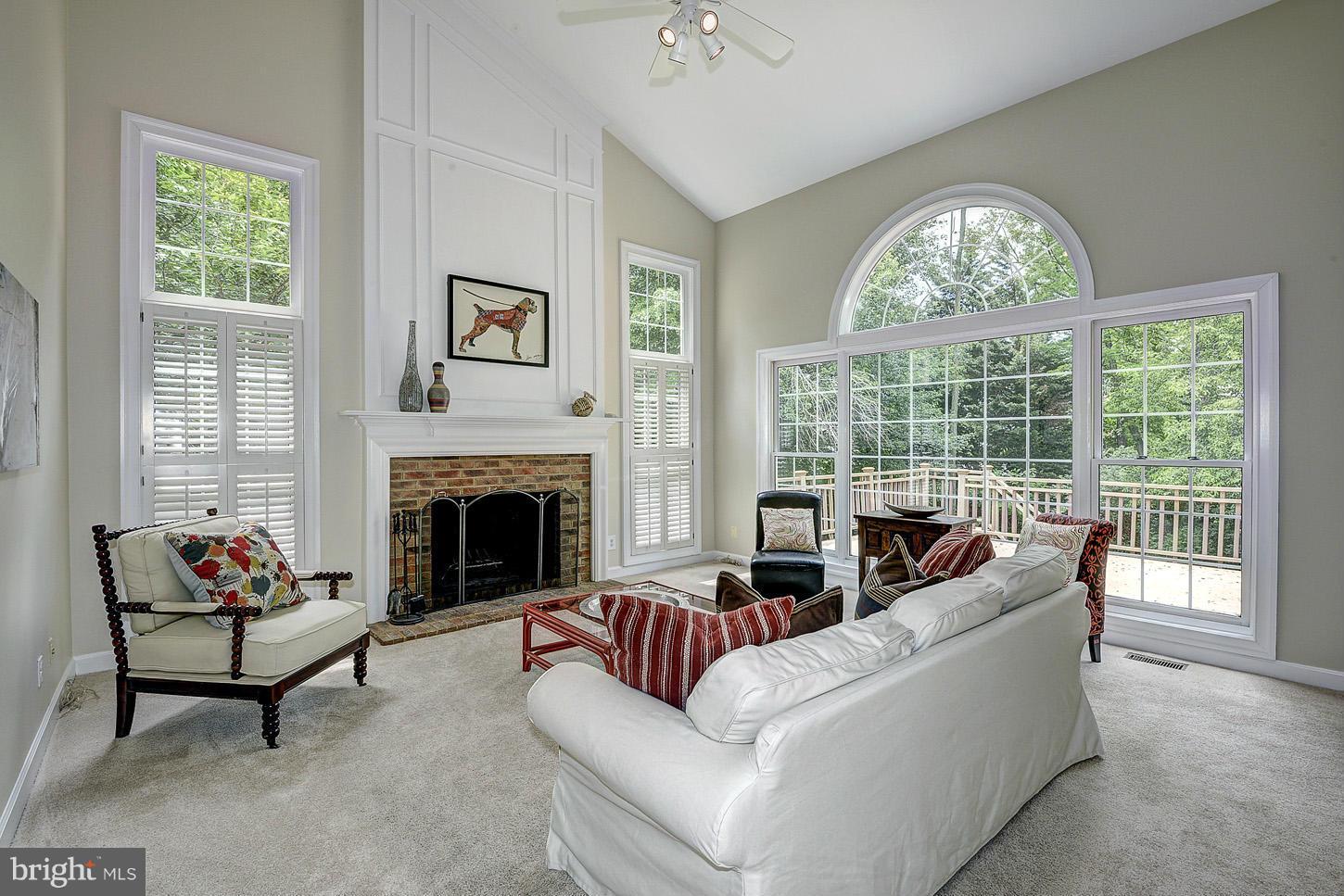 9730 Hidden Valley Road Vienna, VA 22181 - Photo 8 of 30 a living room with furniture and a fireplace