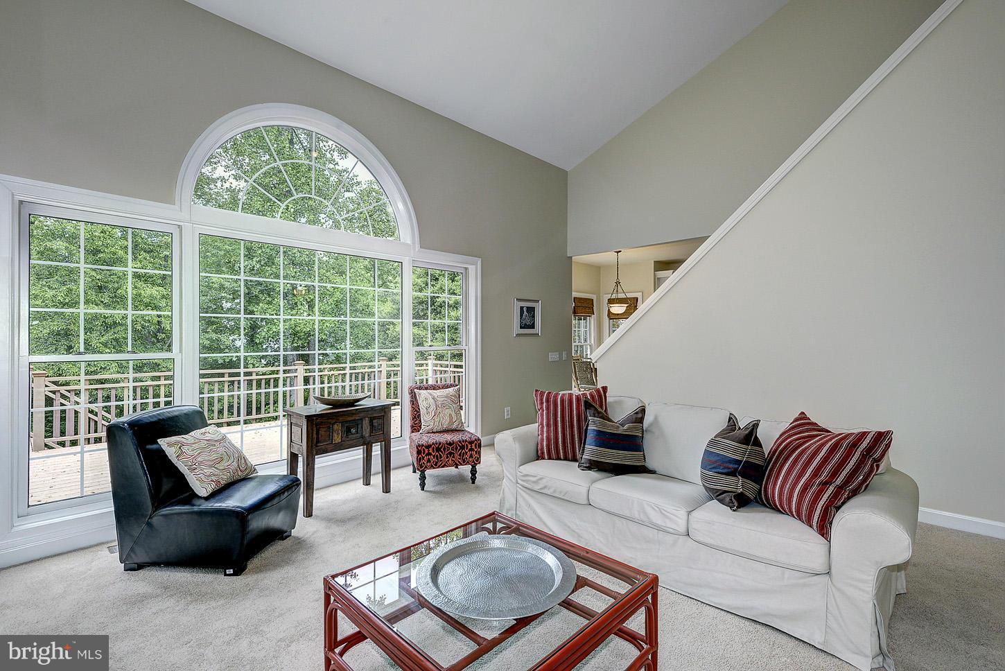 9730 Hidden Valley Road Vienna, VA 22181 - Photo 9 of 30 a living room with furniture and a floor to ceiling window