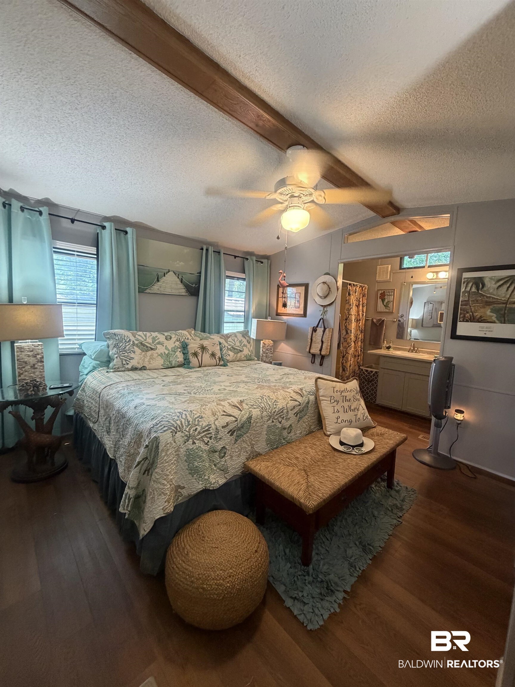 1620 Del Rey Drive Lillian, AL 36549 - Photo 14 of 45 Wood-finish flooring throughout, complemented by a textured ceiling featuring exposed wood beams