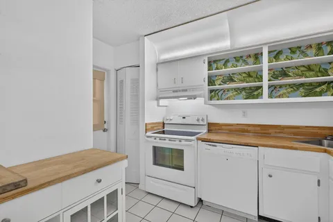 a kitchen with a stove and a window