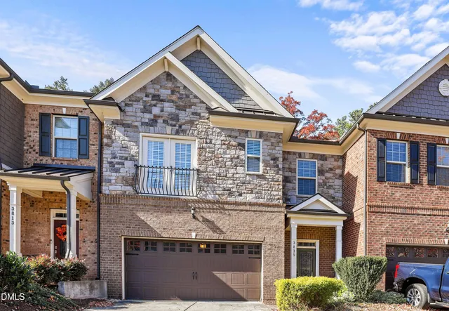 a view of a brick building next to a yard