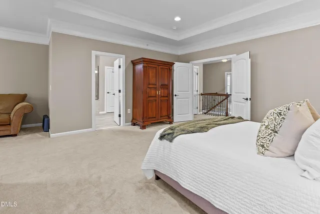 a bedroom with a large bed and furniture