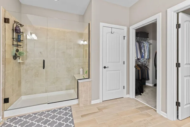 a view of a bathroom from a hallway
