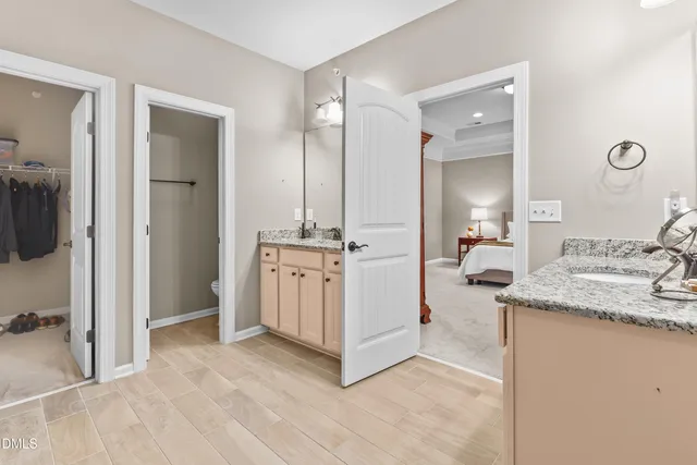 a view of a bathroom with a sink and mirror