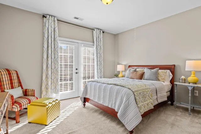 a bedroom with a bed and a couch