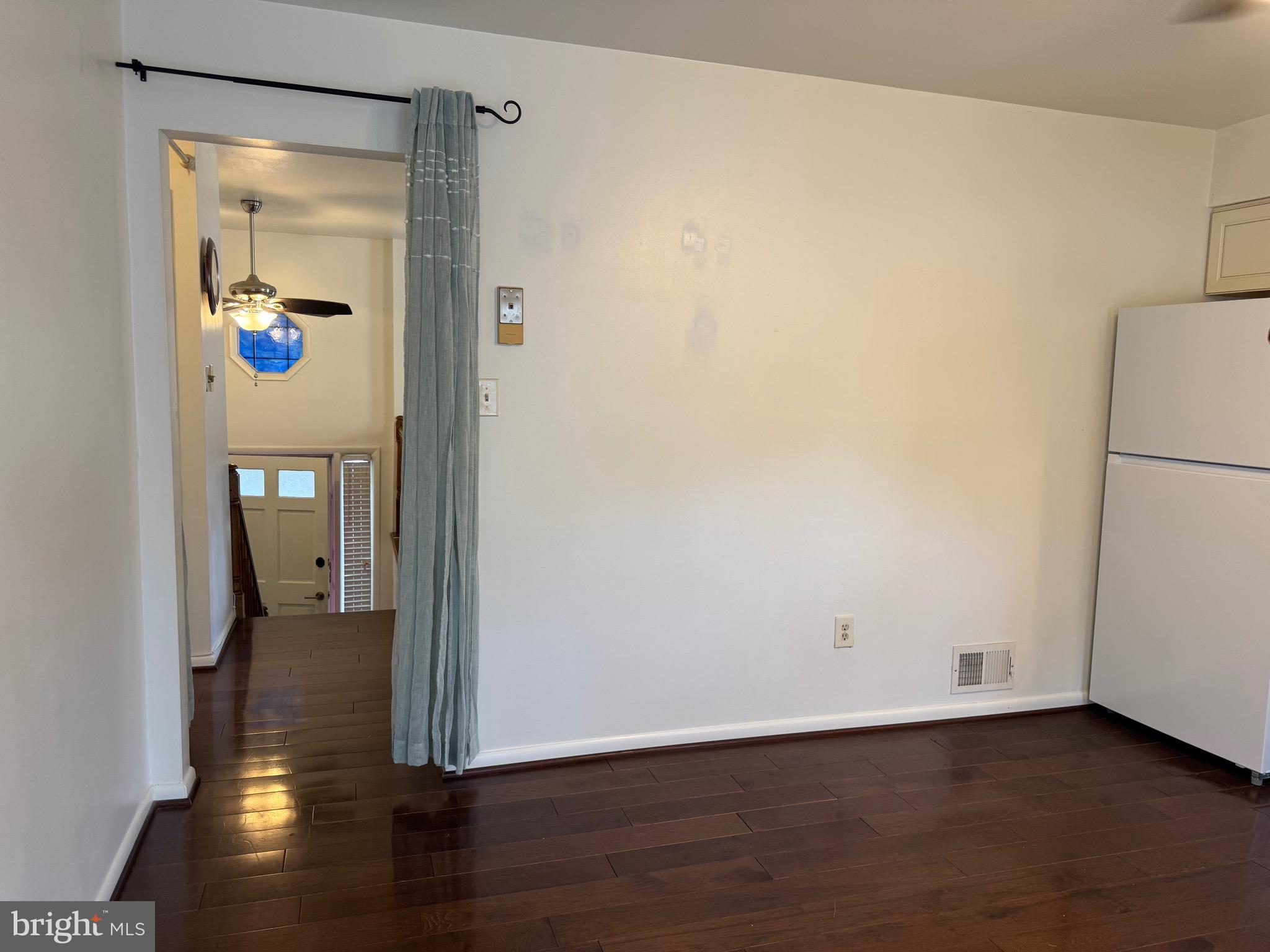 212 11th Street Laurel, MD 20707 - Photo 10 of 39 a view of a hallway with wooden floor and closet