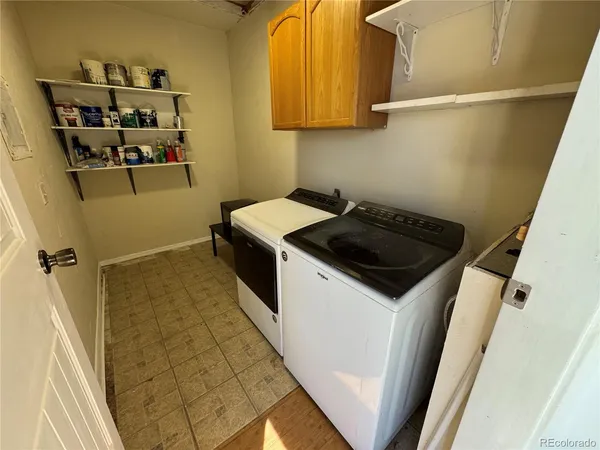 a kitchen with a stove and a refrigerator