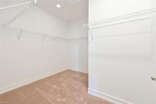 a bathroom with a shower sink and mirror