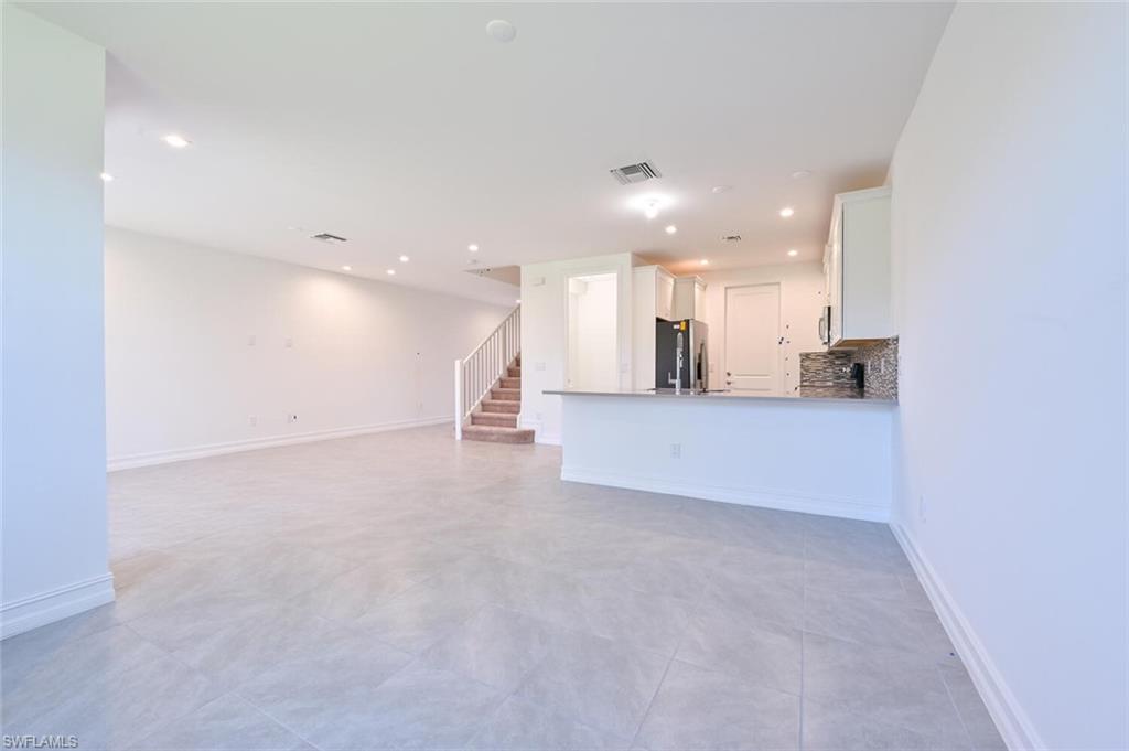 7611 Morgan Way Naples, FL 34119 - Photo 3 of 26 a view of a kitchen with a sink and cabinets