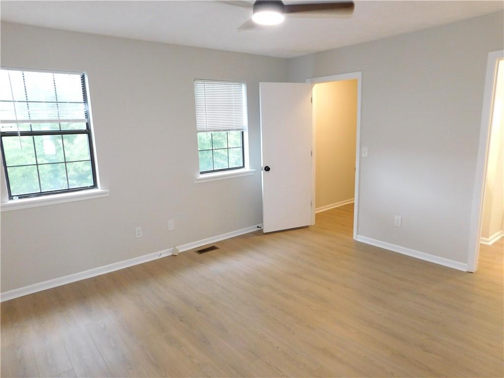 3589 North Hopkins Court Powder Springs, GA 30127 - Photo 16 of 17 an empty room with windows and closet