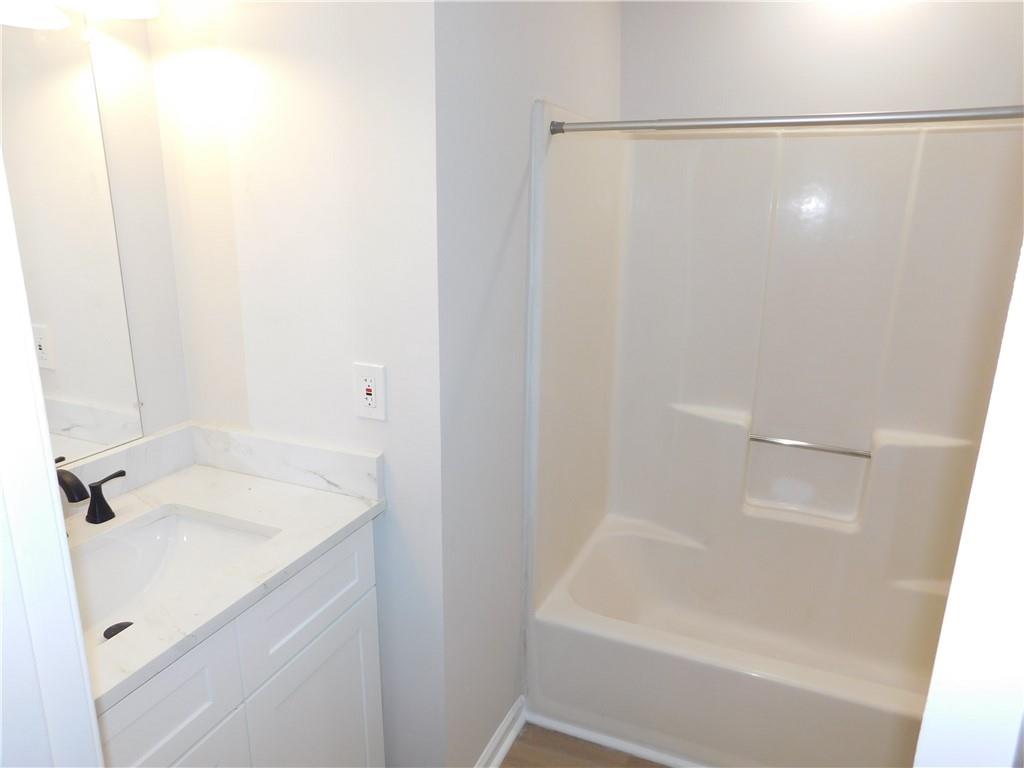 3589 North Hopkins Court Powder Springs, GA 30127 - Photo 17 of 17 a bathroom with a shower and a sink