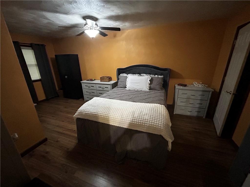 22 Dawn Drive Indiana, PA 15701 - Photo 13 of 27 a bedroom with a bed and a chandelier