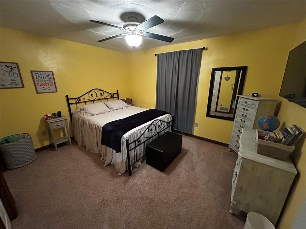 22 Dawn Drive Indiana, PA 15701 - Photo 19 of 27 a bedroom with a bed and a walk in closet