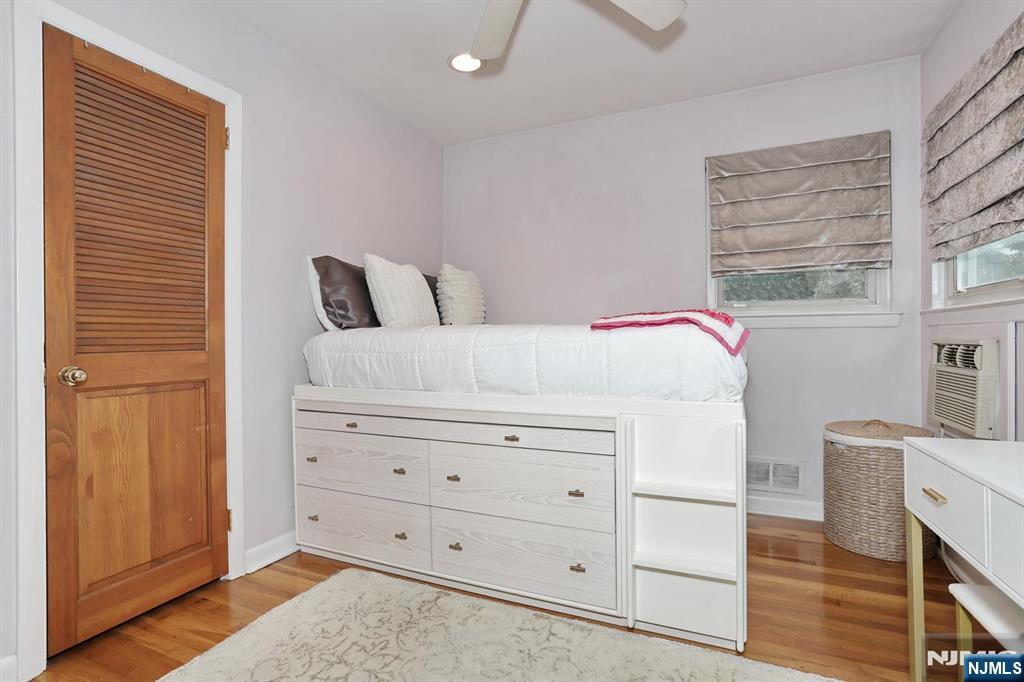 87 Barbara Road Dumont, NJ 07628 - Photo 25 of 48 a bedroom with a bed and a dresser