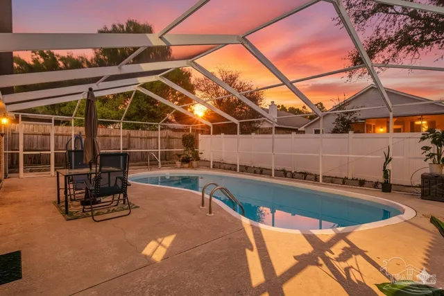 a view of a swimming pool with a patio