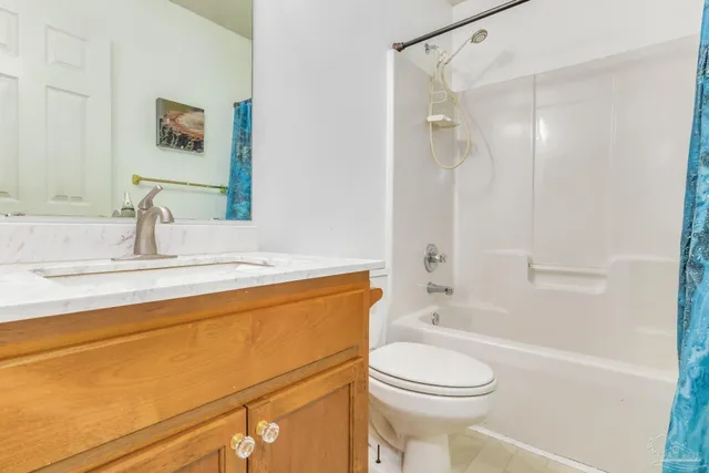 a bathroom with a white bath tub and a shower