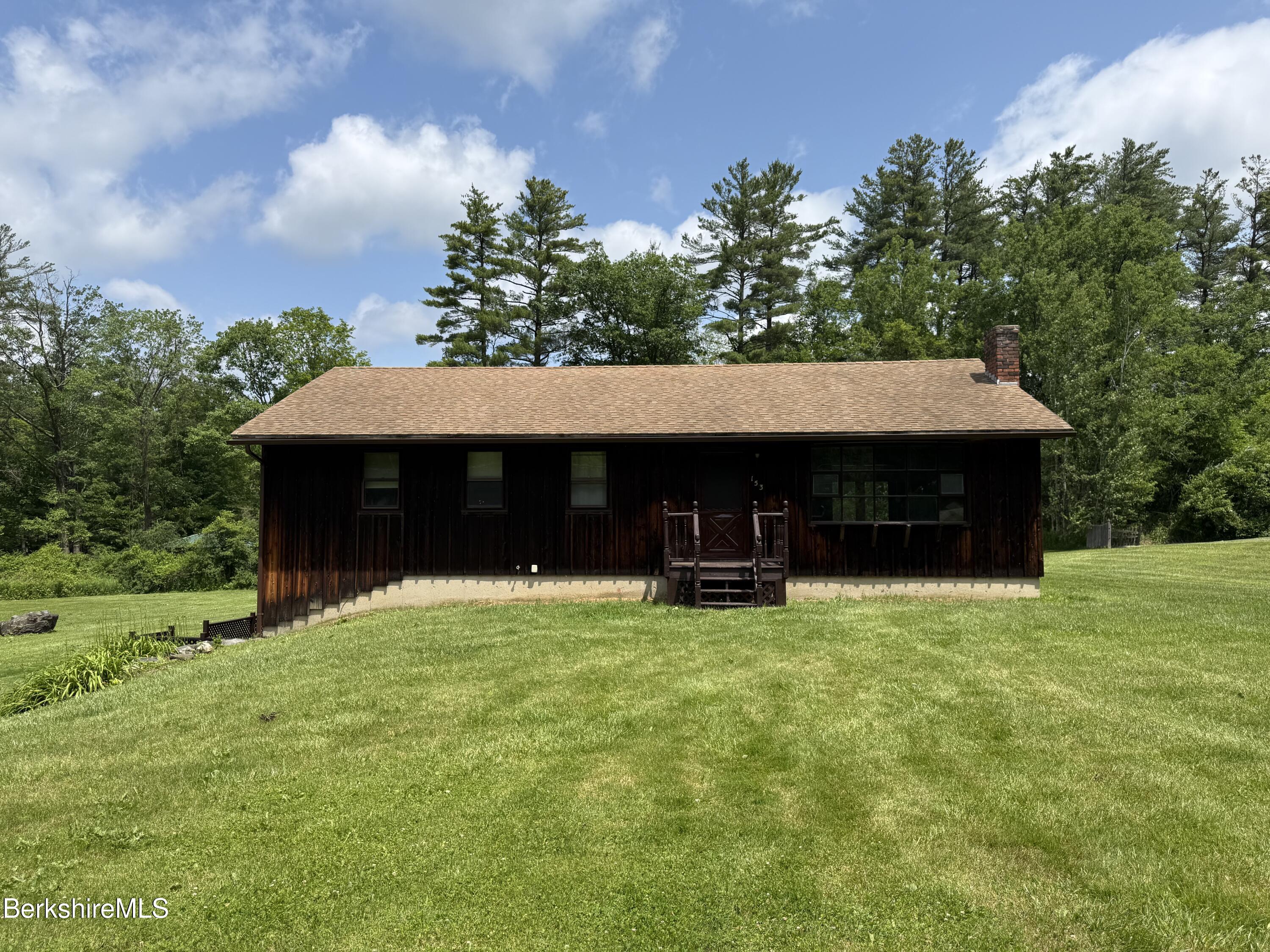 153 East Dugway Road Lenox, MA 01240 - Photo 1 of 26 a view of house with yard and sitting area