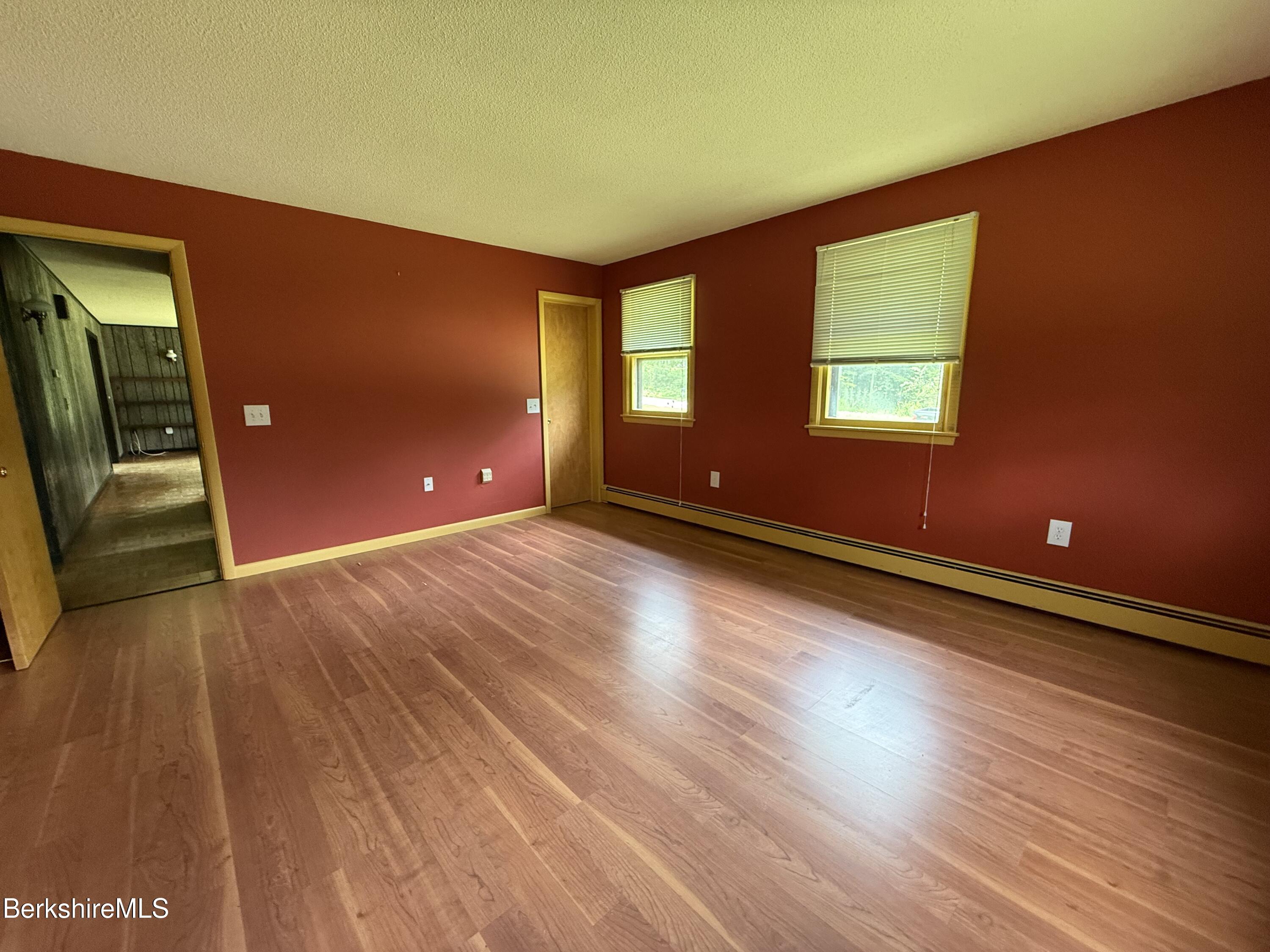 153 East Dugway Road Lenox, MA 01240 - Photo 16 of 26 a view of room with window and wooden floor