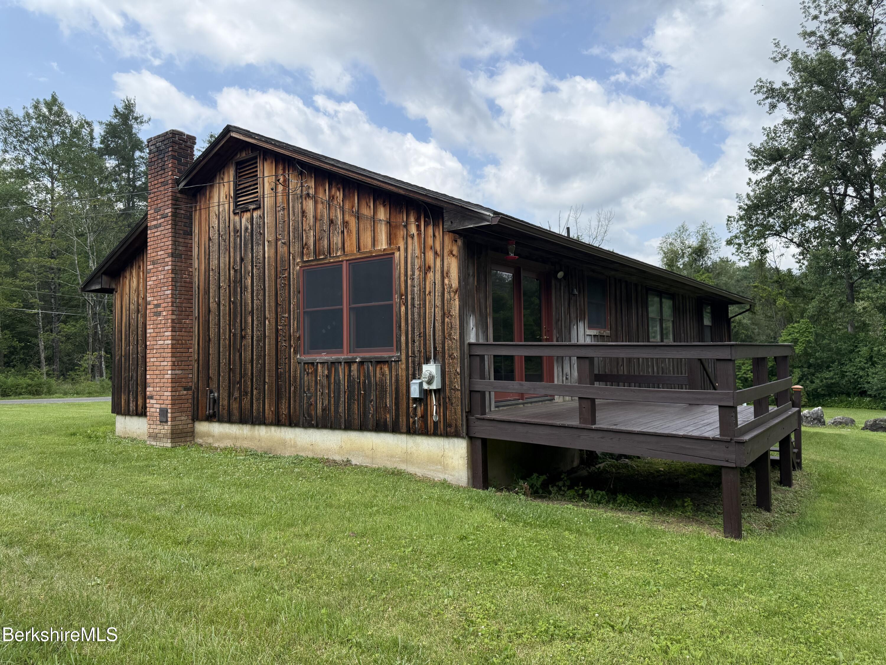 153 East Dugway Road Lenox, MA 01240 - Photo 4 of 26 a view of backyard with barbeque grill and wooden fence