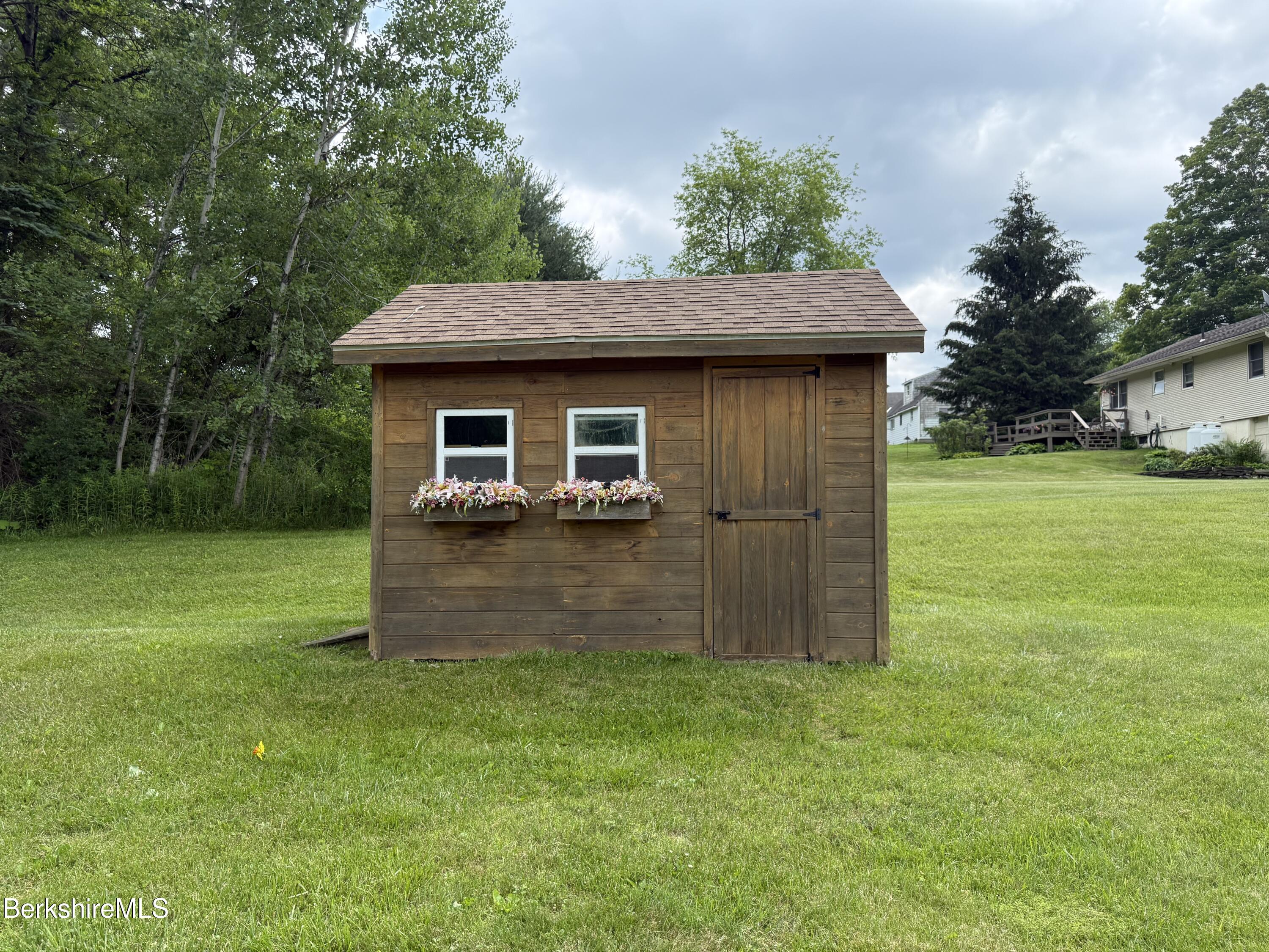 153 East Dugway Road Lenox, MA 01240 - Photo 5 of 26 a front view of house with a garden