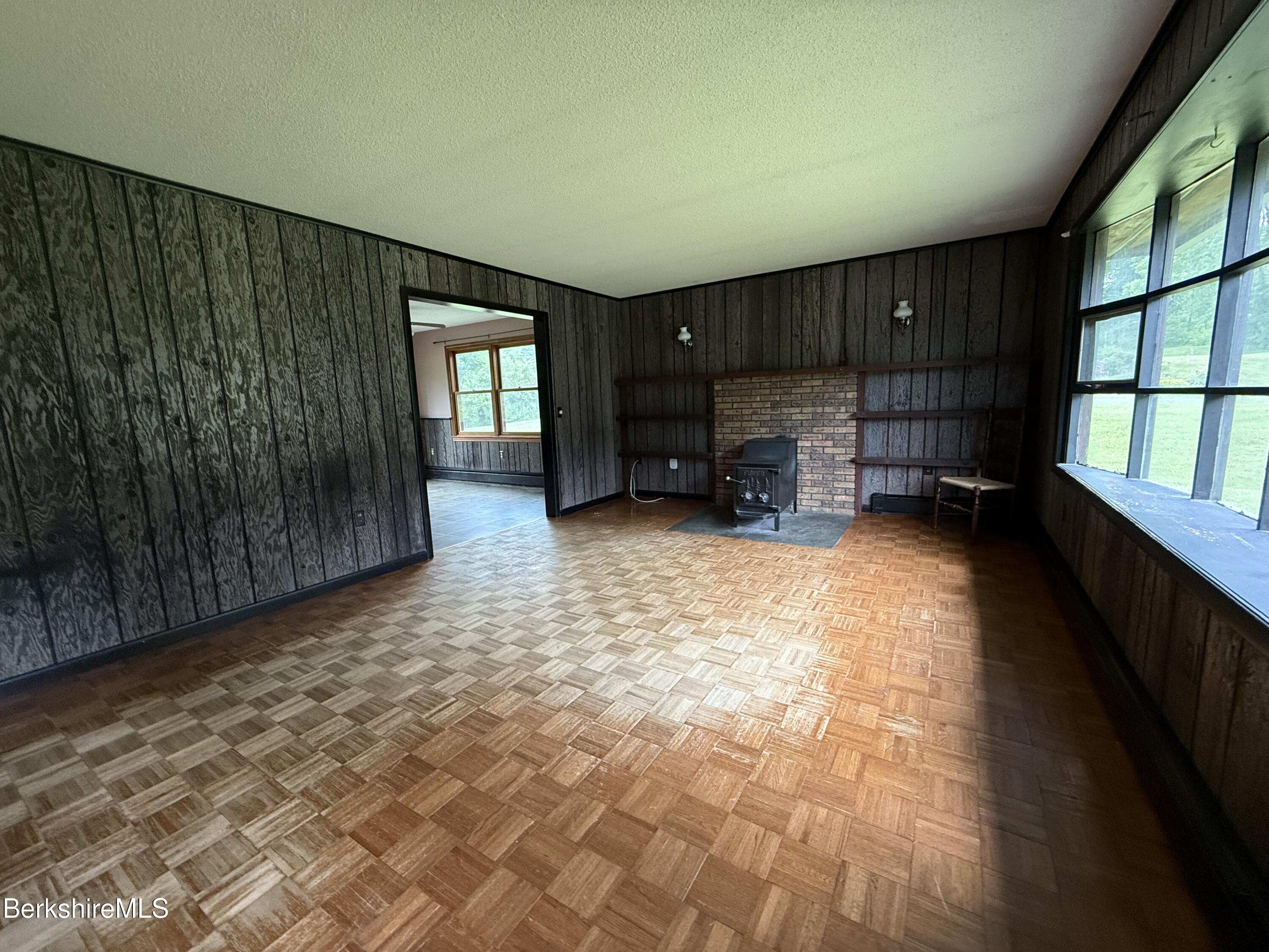 153 East Dugway Road Lenox, MA 01240 - Photo 7 of 26 en empty room with furniture and a window