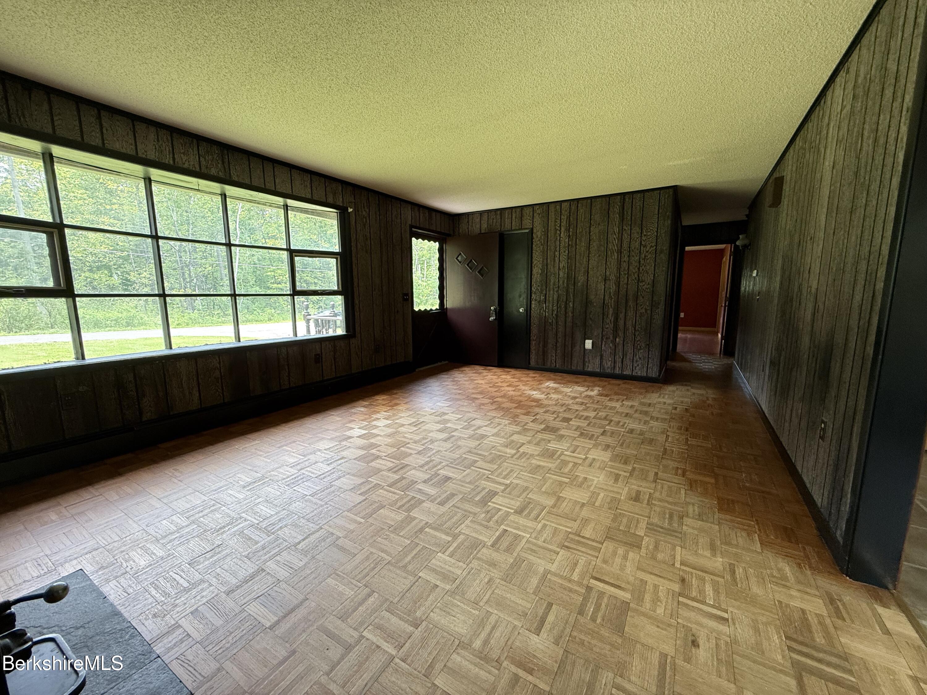 153 East Dugway Road Lenox, MA 01240 - Photo 9 of 26 en empty room with windows