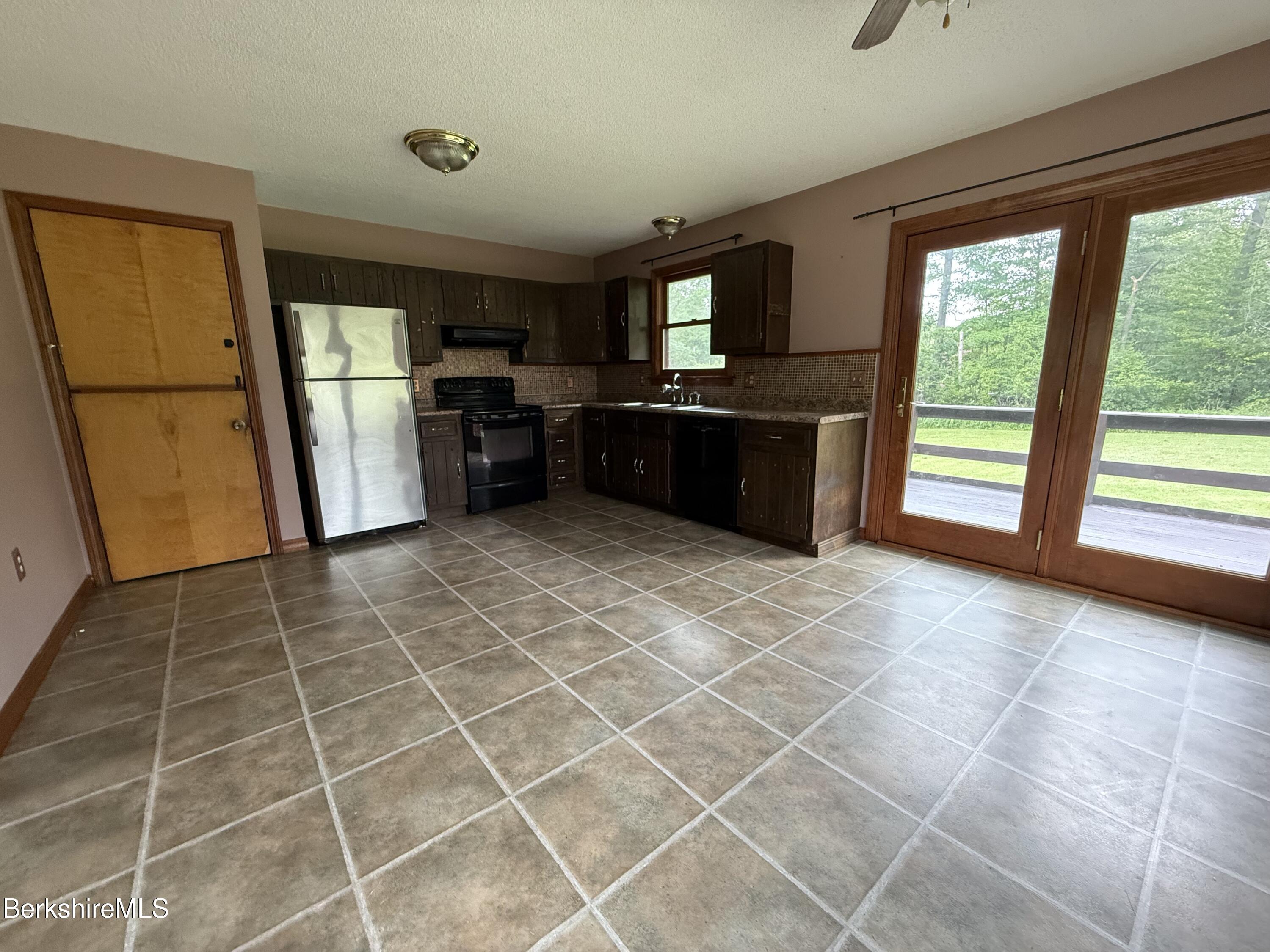 153 East Dugway Road Lenox, MA 01240 - Photo 10 of 26 a large kitchen with a stove a refrigerator and a sink