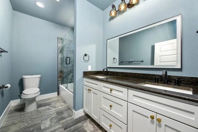 a view of a hallway view with wooden floor and staircase
